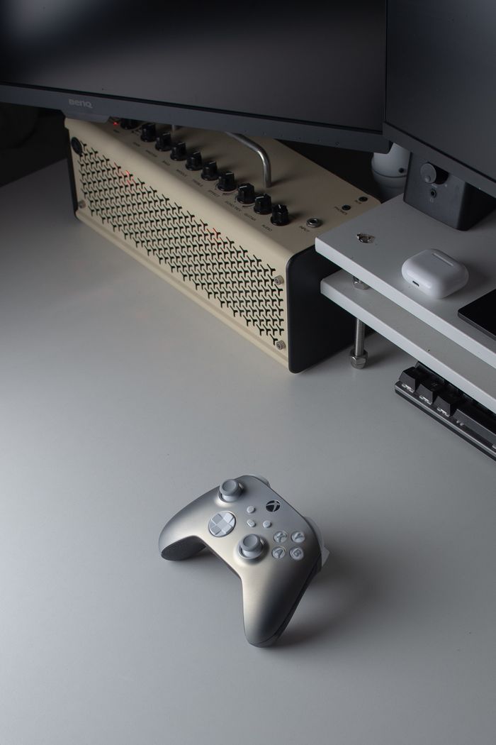 services-04 A sleek and modern gaming setup featuring a console controller and technology accessories in a minimalist setting.